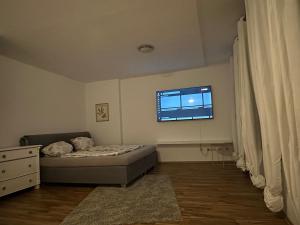 a small bedroom with a bed and a window at Lee 42,8 in Bremerhaven