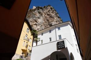 a view of a building with a mountain in the background at On The Rock in Arco