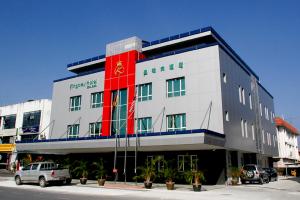 a large building with a red and white at Kingsley Hotel in Miri
