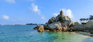 an island in the water with a church on it at Camping 3 étoiles - Piscine - à 2 minutes des plages in Penvénan +31 photos