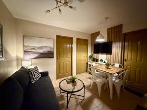 a living room with a couch and a table at 8 Spatial Condo in Davao City
