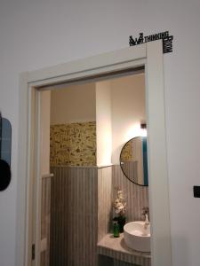 a bathroom with a sink and a mirror at Nonno Turiddu Elegant Rooms in Caccamo +21 photos