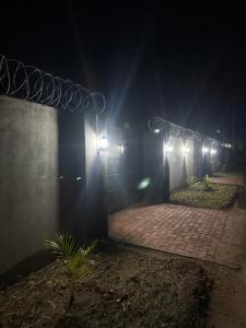 a row of lights on a building at night at Samash villas 2 in Lusaka +7 photos