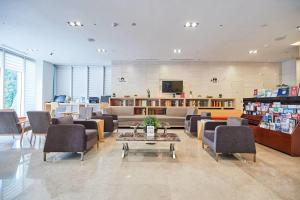 a waiting room with couches and chairs and a table at Days Hotel by Wyndham Seoul Myeongdong in Seoul