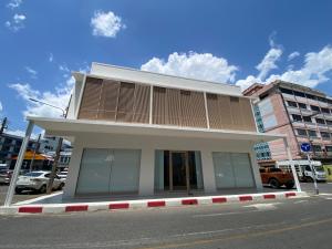 a building on the side of a street at The Atelier House in Krabi
