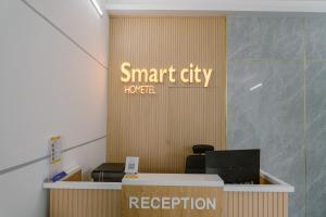 an office with a sign that reads smart city house reception at SmartCity Hometel in Can Tho