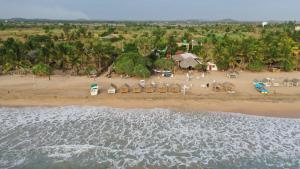 an aerial view of a beach with a resort at Thats why beach hotel in Trincomalee
