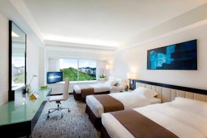 TV o dispositivi per l'intrattenimento presso Regal Riverside Hotel