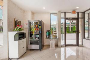 a room with a refrigerator with drinks in it at Quality Hotel Fallsview Cascade in Niagara Falls