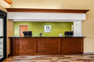 a lobby with a desk with two computers on it at Quality Inn & Suites Vail Valley in Eagle +26 photos