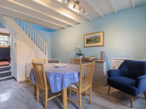 a dining room with a table and chairs at Preswylfa in Blaenau-Ffestiniog +24 photos