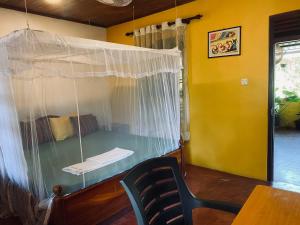 a room with a bed with a net at Nimal`s Homestay in Hikkaduwa +70 photos