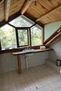a bathroom with a sink and a window at Yallingup Surfing wineries and restaurants in Yallingup +26 photos