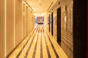 a hallway of a building with wooden floors at Reya Creek Hotel in Dubai