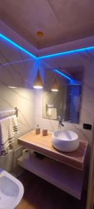 a bathroom with two sinks and a large mirror at Nina in Love in Salerno +32 photos