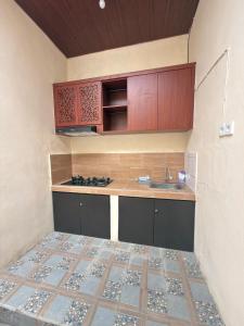 a kitchen with a sink and a counter top at Villa Bianca Lovina by GEMA MANAGEMENT BALI in Lovina