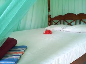 Postel nebo postele na pokoji v ubytování Rainbow Guest House
