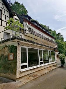 a building with large windows on the side of it at Zeitinsel Doos in Waischenfeld