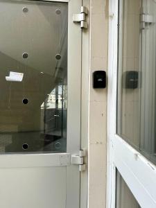 a close up of a door with a window at Studio le Capricorne 22 in Martigny-Ville