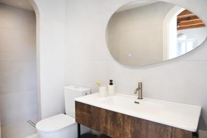 a bathroom with a sink and a toilet at Anoi Kalymnos in Khoríon +20 photos
