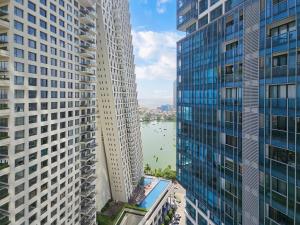 a view of a river between two tall buildings at Evolve - Céleste in Colombo