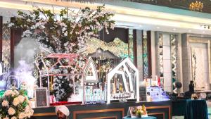 a lobby with a christmas display in a store at Tivoli Bijwasan in Jāmb +14 photos