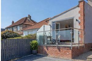 a glass extension to a brick house at The View at 52, Whitby in Whitby