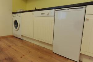 Kuchyň nebo kuchyňský kout v ubytování Toldi Apartments Pécs