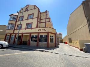 a building on the side of a street at Zi Wu Self Catering Apartment in Swakopmund
