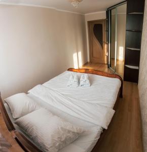 Säng eller sängar i ett rum på Apartments Moskovskiy trakt 14