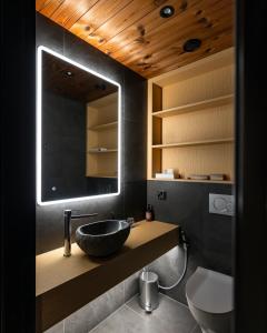 a bathroom with a sink and a mirror at Star Arctic Hotel & Activities in Saariselka +55 photos