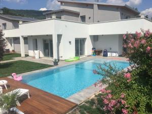 a swimming pool in the backyard of a house at IseoLakeRental - Villa Edwige in Provaglio d'Iseo