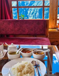 a tray with rice and bowls of food on a table at Hotel Sheryang in Namche