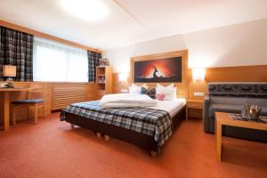 Postel nebo postele na pokoji v ubytování Hotel Sonnblick