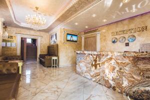 a lobby with a reception counter in a building at Avenue Deluxe Hotel in Sunny Beach