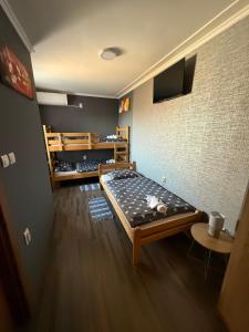 a bedroom with a large bed in a room at Vila Alexandra 2025 in Bačka Topola