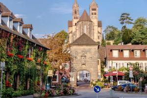 a street in a town with a church at Kaiserstühler-Hof in Breisach am Rhein