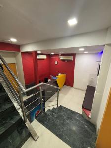 an empty room with a staircase in a building at Hotel Silver Shine Jogeshwari in Mumbai
