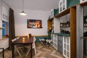 a dining room with a table and a kitchen at The House Company in Istanbul
