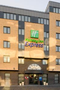 
a building with a sign on the front of it at Holiday Inn Express Hasselt, an IHG Hotel in Hasselt
