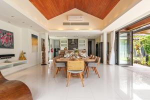 a dining room with a table and chairs at Baan Leelawadee in Bophut