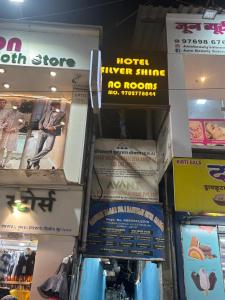 a store with a bunch of signs on the wall at Hotel Silver Shine Jogeshwari in Mumbai
