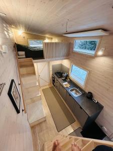 an overhead view of a tiny house with a sink and stairs at Tiny House im Almtal in Pettenbach