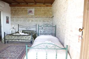 Postel nebo postele na pokoji v ubytování Il Borgo Ariccia Resort