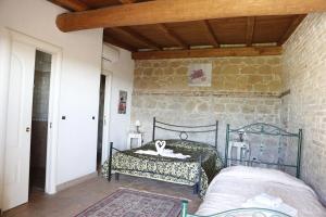 Postel nebo postele na pokoji v ubytování Il Borgo Ariccia Resort