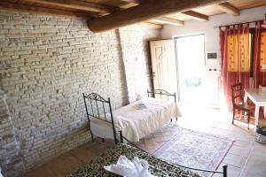 Postel nebo postele na pokoji v ubytování Il Borgo Ariccia Resort