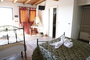 Postel nebo postele na pokoji v ubytování Il Borgo Ariccia Resort