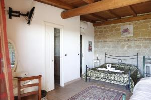 Postel nebo postele na pokoji v ubytování Il Borgo Ariccia Resort