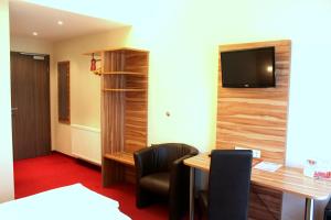 TV a/nebo společenská místnost v ubytování Come IN Hotel