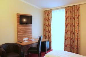 TV a/nebo společenská místnost v ubytování Come IN Hotel